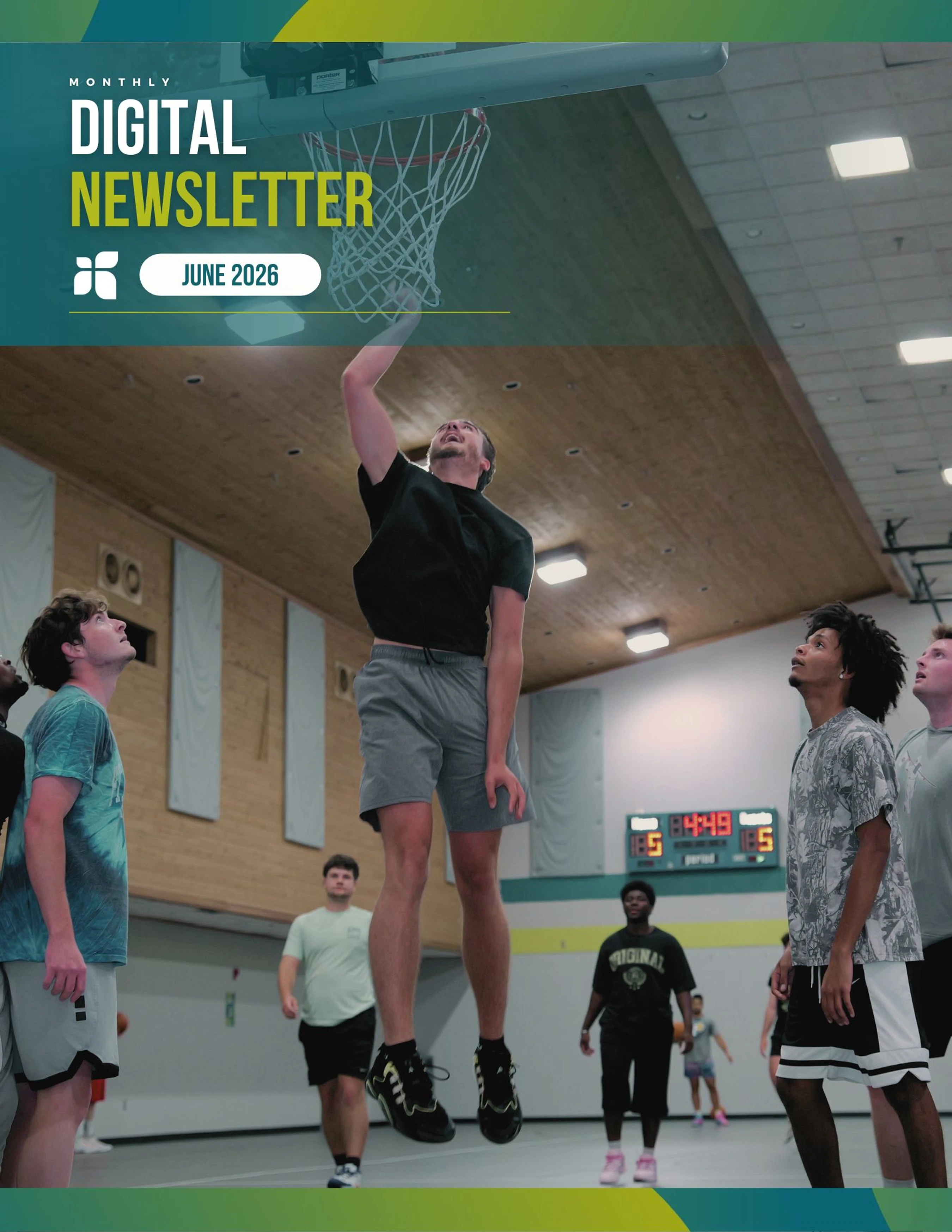 A man in mid-air attempts a layup during a basketball game while other players watch. A banner at the top reads 'Monthly Digital Newsletter June 2026'.