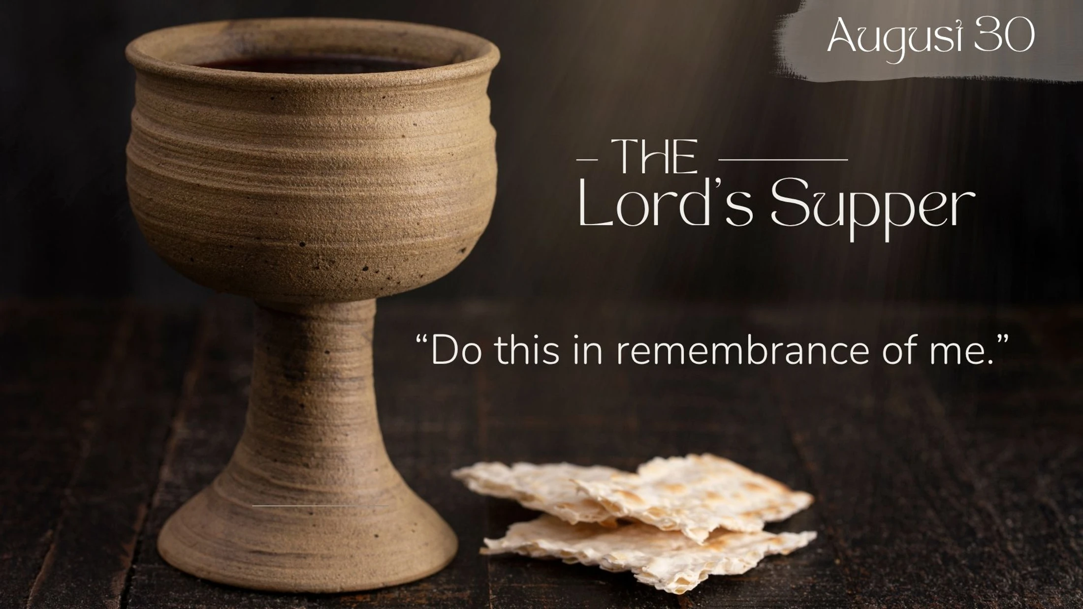 A rustic chalice of wine and broken bread on a dark table. Text reads: The Lord's Supper, 'Do this in remembrance of me,' and August 30.